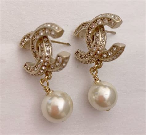 chanel pearl drop earrings gold|More.